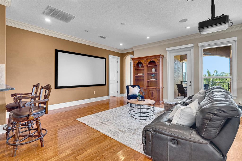 8707 Silverthorn Road Seminole, FL 33777 - Photo 24 of 58 a living room with furniture and a flat screen tv