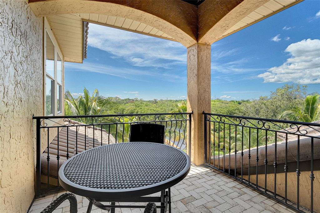 8707 Silverthorn Road Seminole, FL 33777 - Photo 26 of 58 a view of balcony with furniture