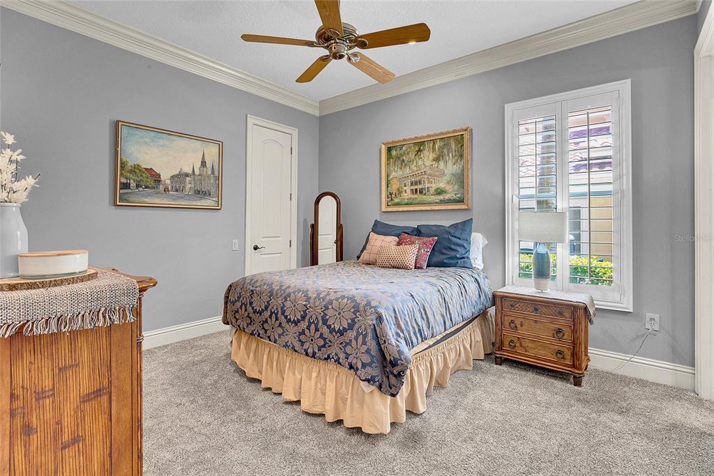 8707 Silverthorn Road Seminole, FL 33777 - Photo 27 of 58 a spacious bedroom with a bed and a window