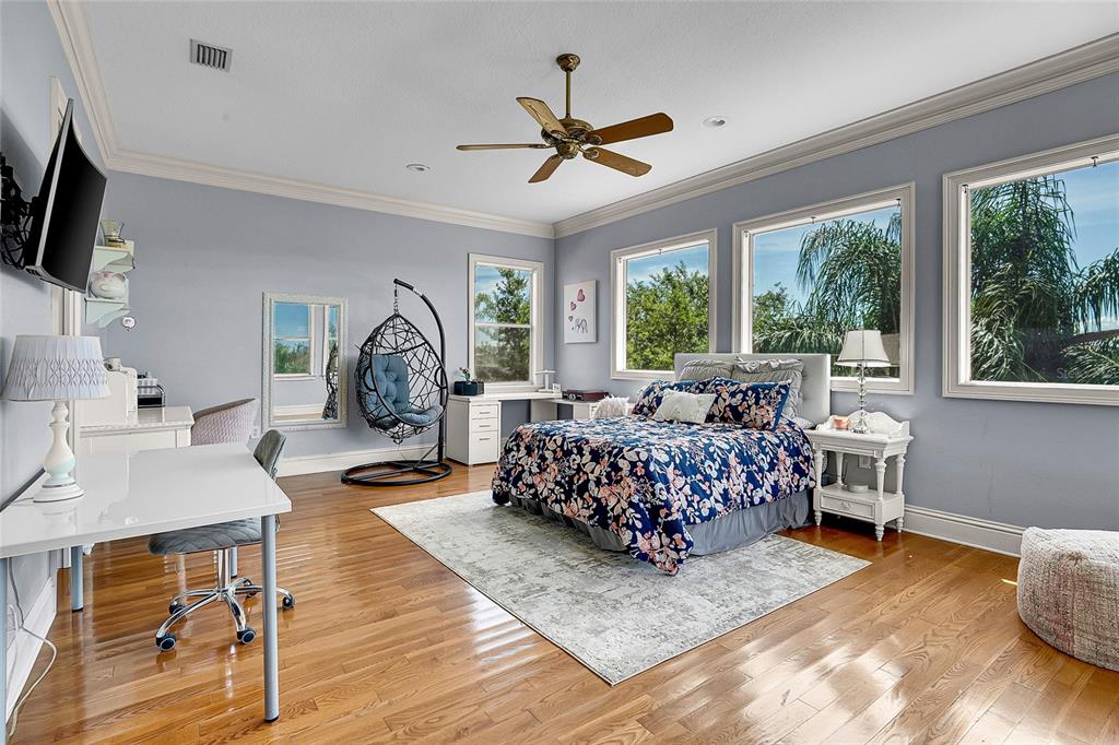 8707 Silverthorn Road Seminole, FL 33777 - Photo 32 of 58 a living room with furniture a window and a flat screen tv