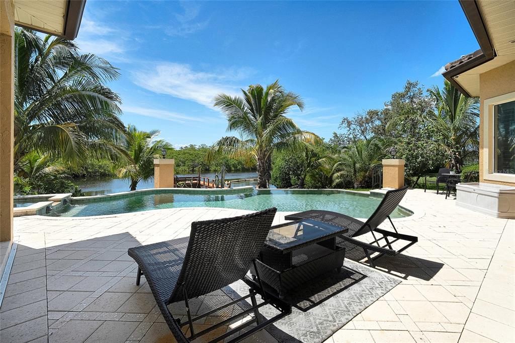 8707 Silverthorn Road Seminole, FL 33777 - Photo 46 of 58 a view of a patio with a yard
