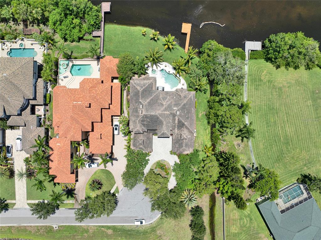 8707 Silverthorn Road Seminole, FL 33777 - Photo 48 of 58 an aerial view of a house with a yard and garden