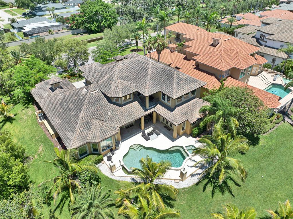8707 Silverthorn Road Seminole, FL 33777 - Photo 53 of 58 an aerial view of a house with yard and outdoor seating