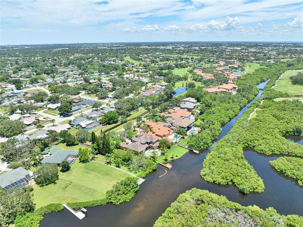 8707 Silverthorn Road Seminole, FL 33777 - Photo 54 of 58 an aerial view of residential houses with outdoor space