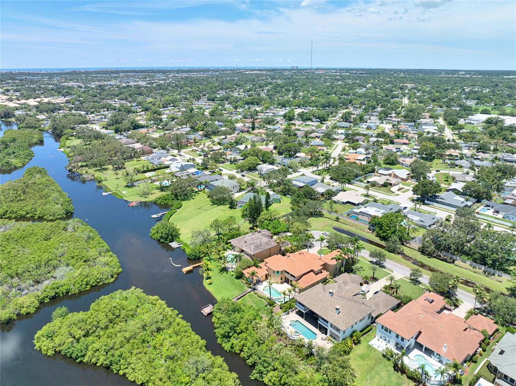 8707 Silverthorn Road Seminole, FL 33777 - Photo 55 of 58 an aerial view of residential houses with outdoor space and trees