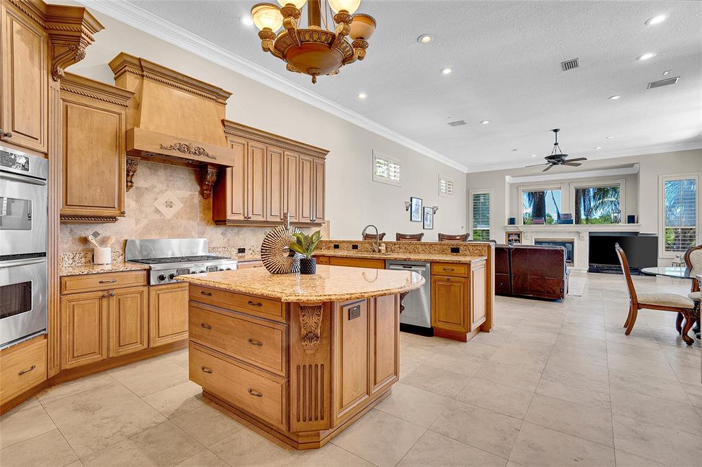 8707 Silverthorn Road Seminole, FL 33777 - Photo 6 of 58 a kitchen with a sink stove and cabinets