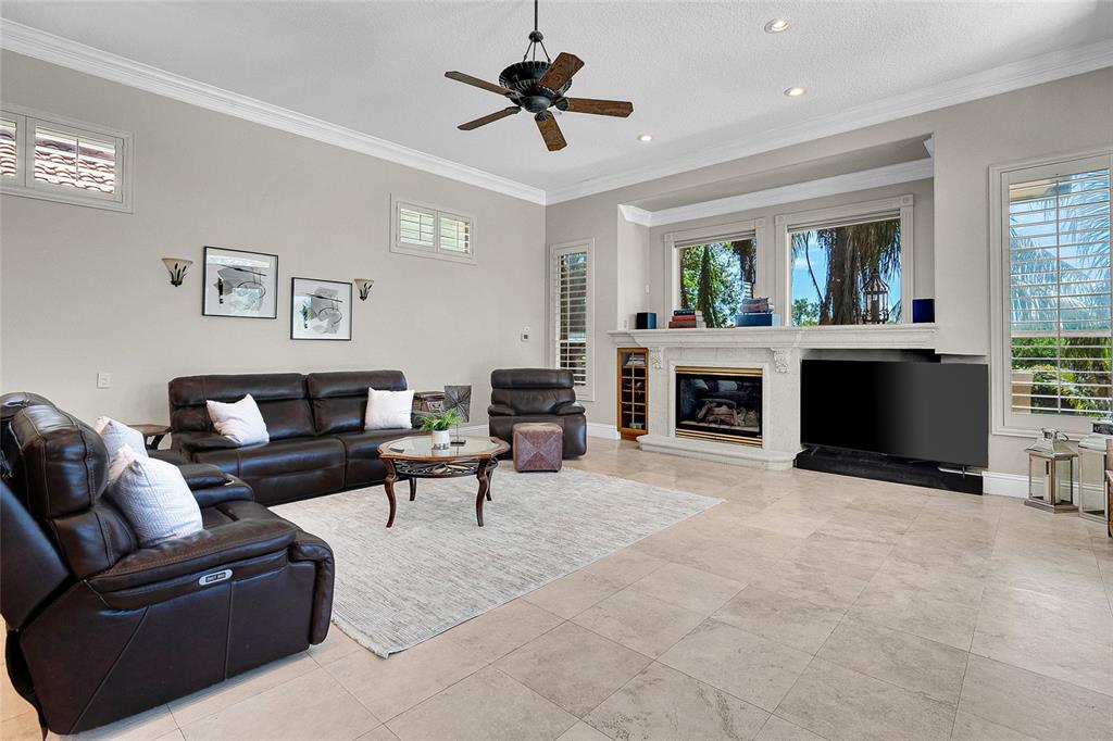 8707 Silverthorn Road Seminole, FL 33777 - Photo 10 of 58 a living room with furniture and a fireplace