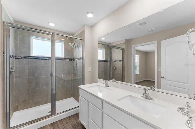 a bathroom with a sink and a large mirror