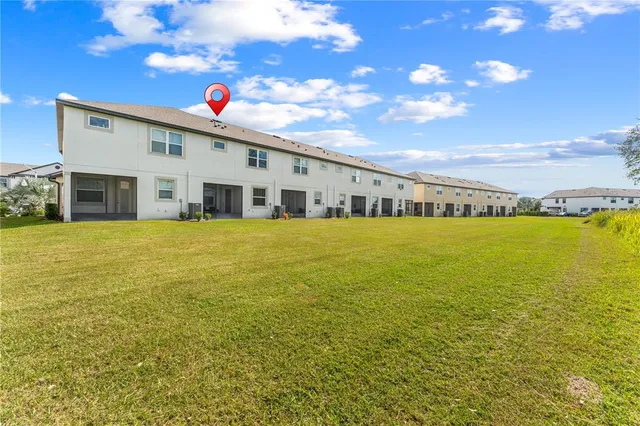 a view of a house with a big yard
