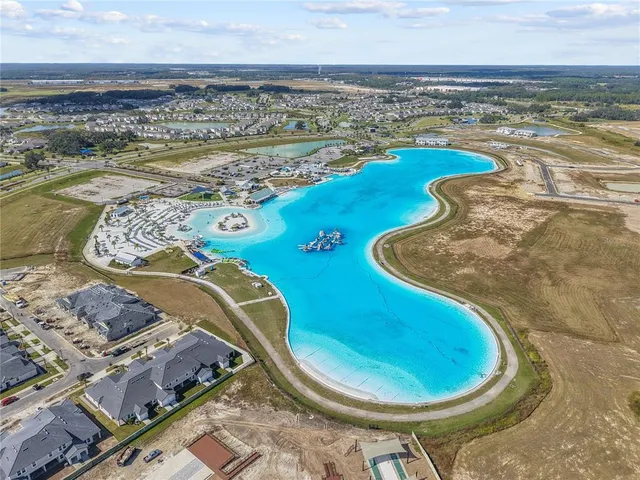a view of a swimming pool with a table and chairs