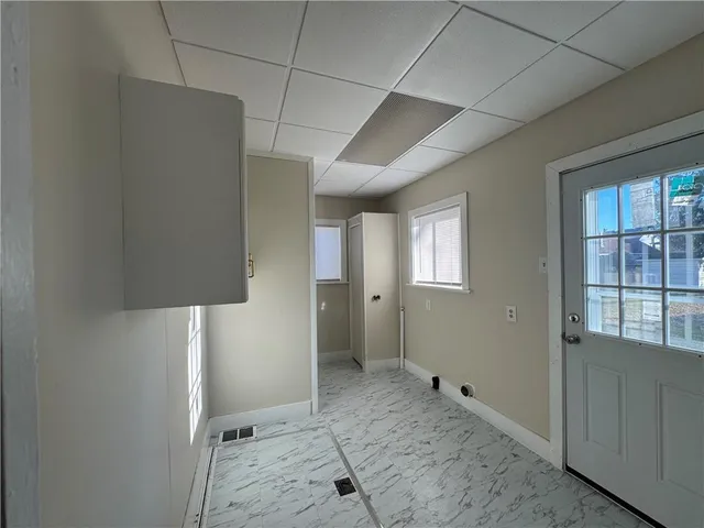 a view of a closet area with entryway