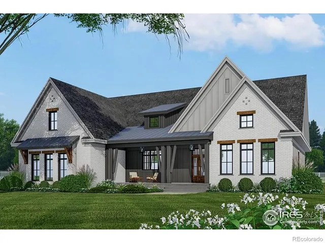a front view of a house with a yard table and chairs