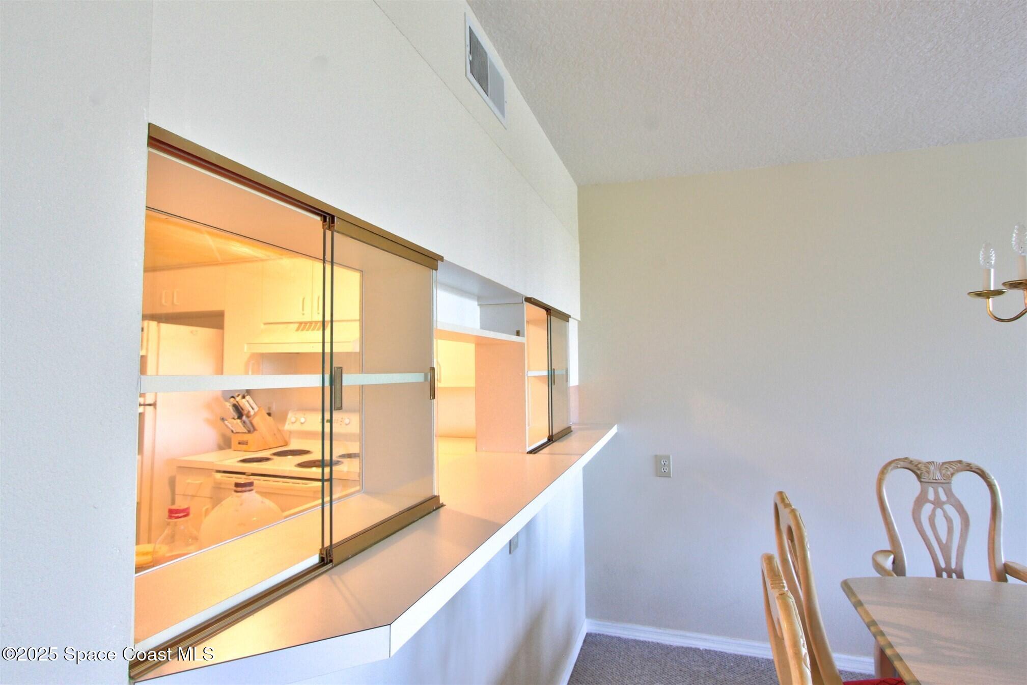 1420 Huntington Lane, Unit 2304 Rockledge, FL 32955 - Photo 30 of 34 a view of an outdoor dining room with a window