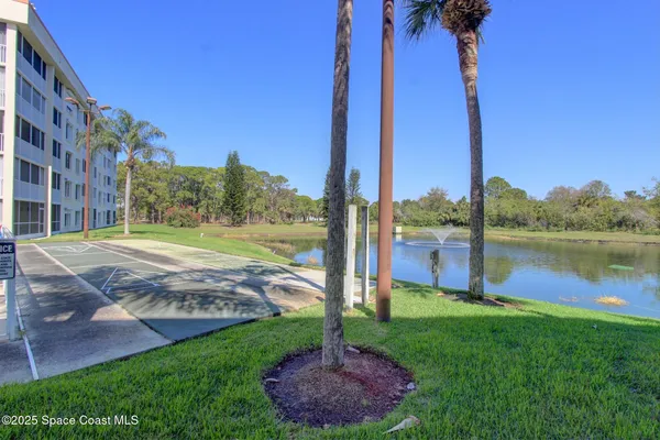 a view of a garden with a lake view