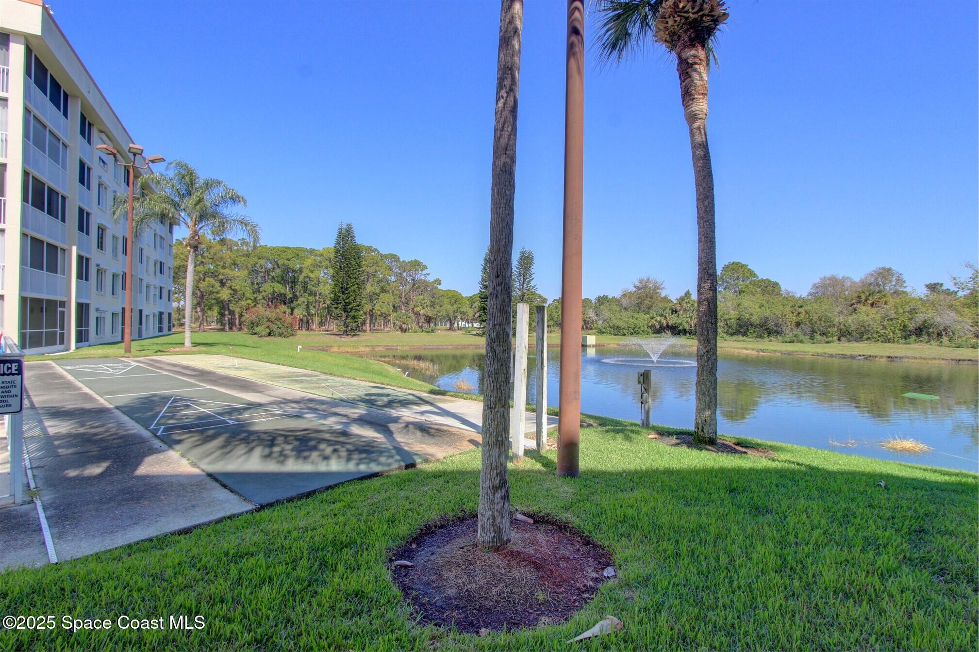 1420 Huntington Lane, Unit 2304 Rockledge, FL 32955 - Photo 6 of 34 a view of a garden with a lake view