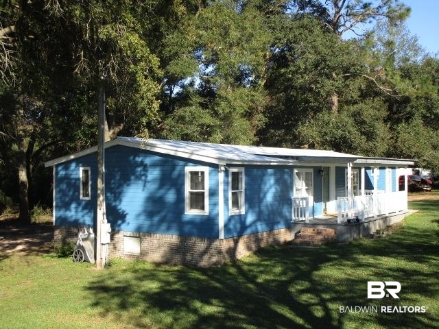 14791 Raber Road Summerdale, AL 36580 - Photo 3 of 21 Back of house with a porch and a yard