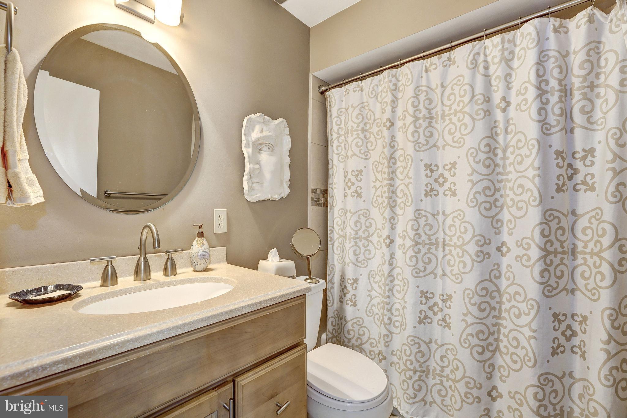 15128 Middlegate Road Silver Spring, MD 20905 - Photo 17 of 30 UPDATED HALL BATH, CORIAN COUNTER