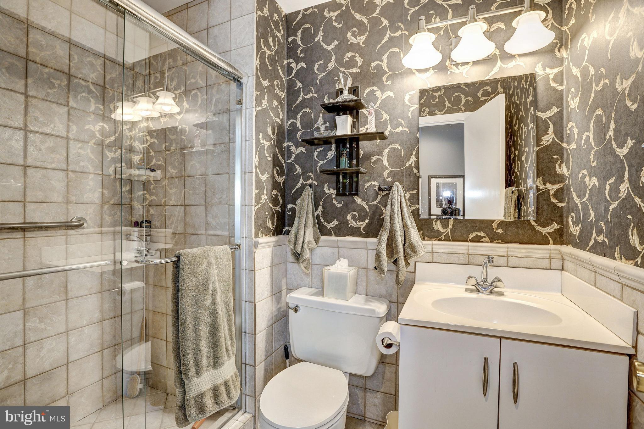 15128 Middlegate Road Silver Spring, MD 20905 - Photo 20 of 30 UPDATED SHOWER, COMMODE, LIGHTING, TILE WORK