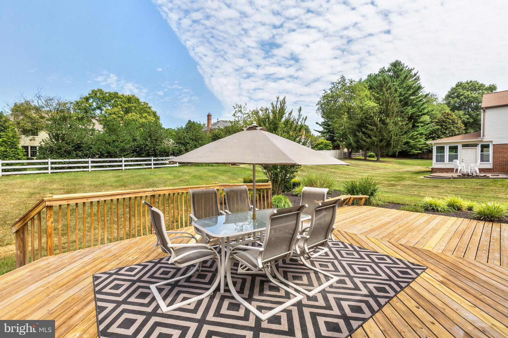 15128 Middlegate Road Silver Spring, MD 20905 - Photo 25 of 30 NEWLY POWER-WASHED DECK. RUG, PATIO SET TO CONVEY