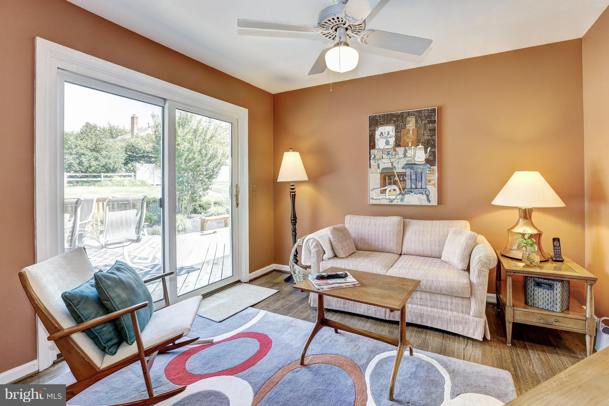 15128 Middlegate Road Silver Spring, MD 20905 - Photo 6 of 30 CURRENTLY LIVING ROOM. NEW SLIDER TO DECK