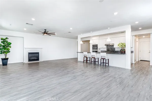 a view of dining room with furniture and wooden floor