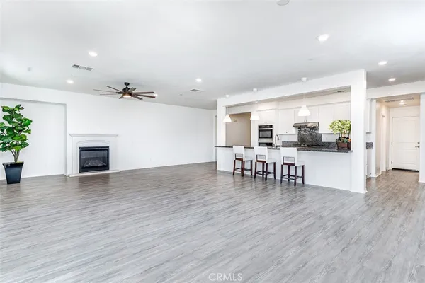 a view of dining room with furniture and wooden floor