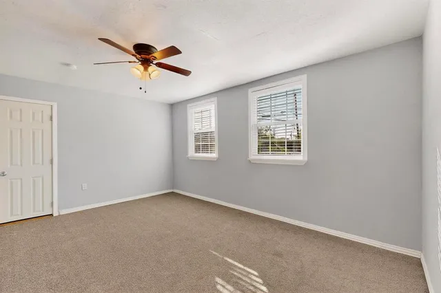 a view of a chandelier fan in a room
