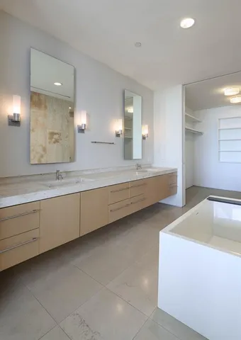 a large bathroom with a large tub and shower