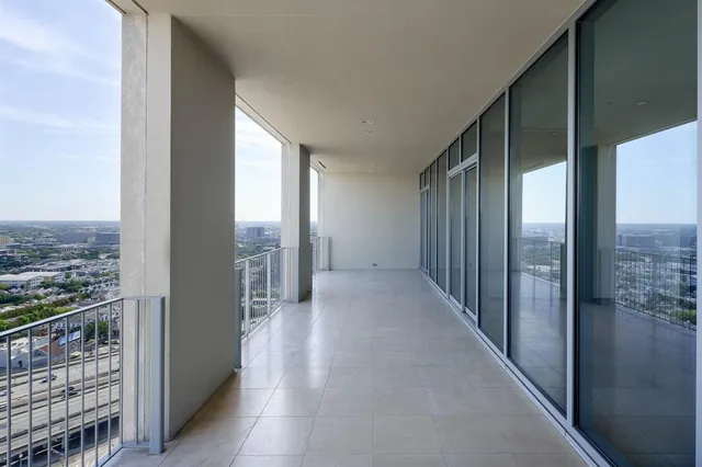 a view of a city from a hallway