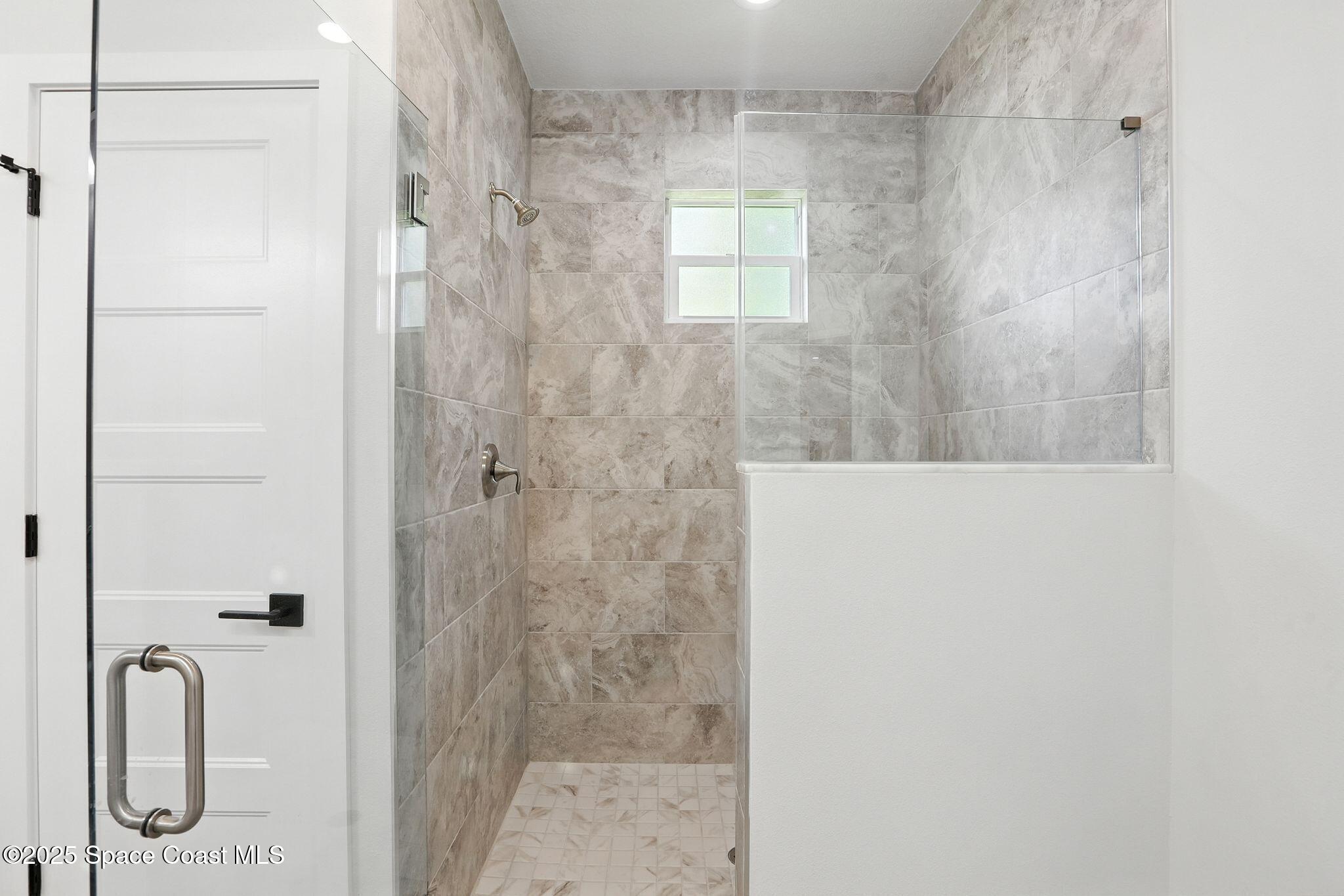 475 Flagler Road Southeast Palm Bay, FL 32909 - Photo 17 of 30 a bathroom with a shower
