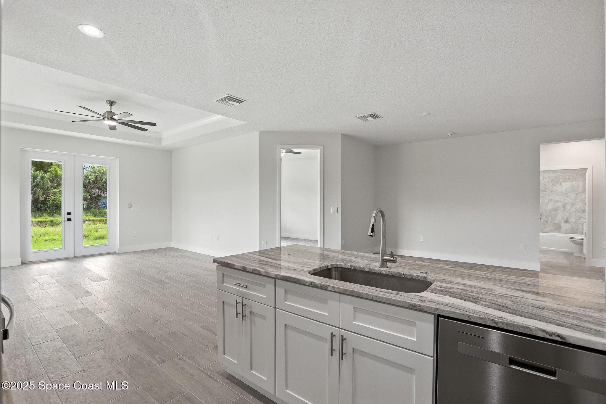 475 Flagler Road Southeast Palm Bay, FL 32909 - Photo 18 of 30 a bathroom with a sink and a mirror