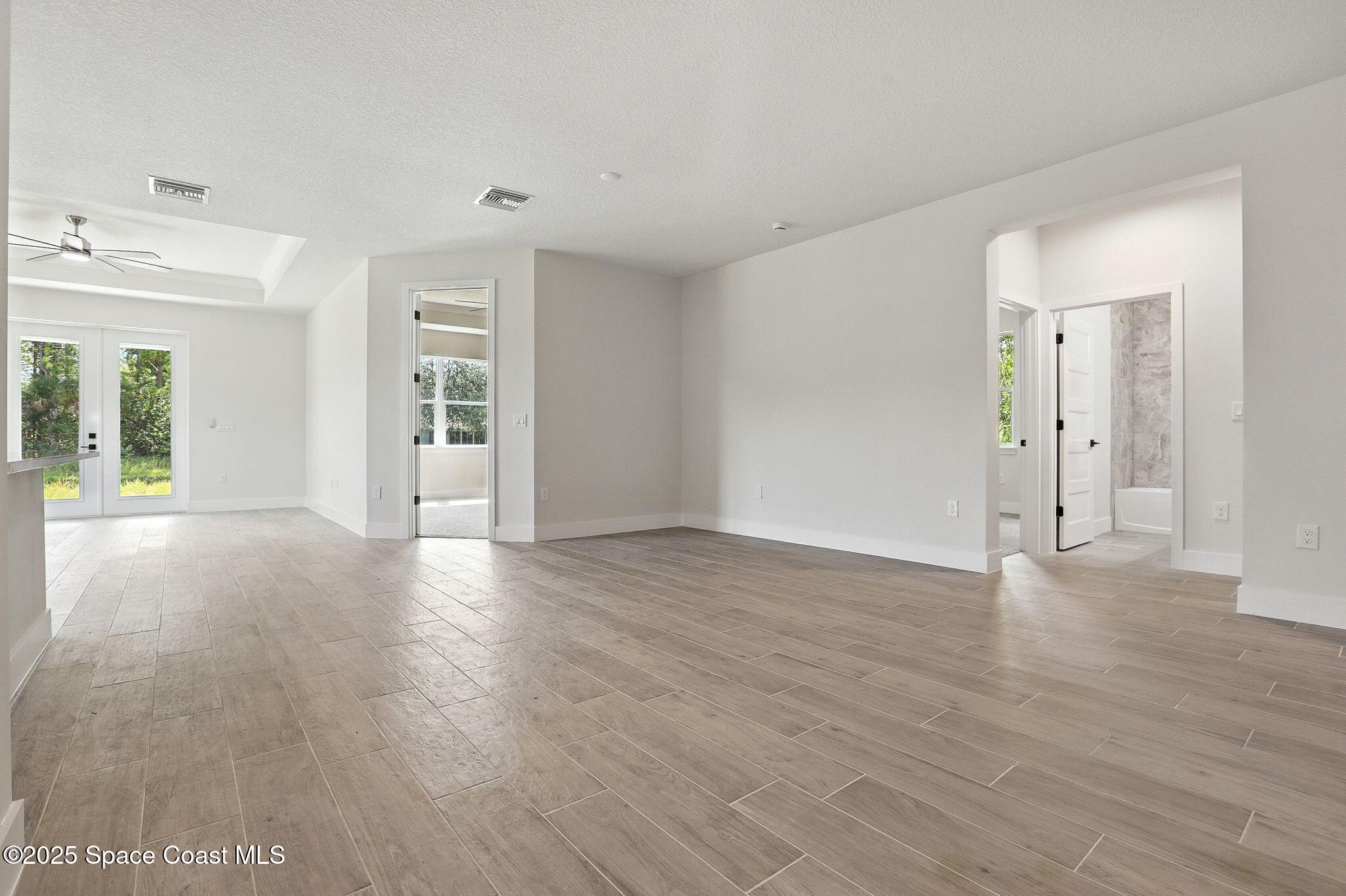 475 Flagler Road Southeast Palm Bay, FL 32909 - Photo 9 of 30 wooden floor in an empty room