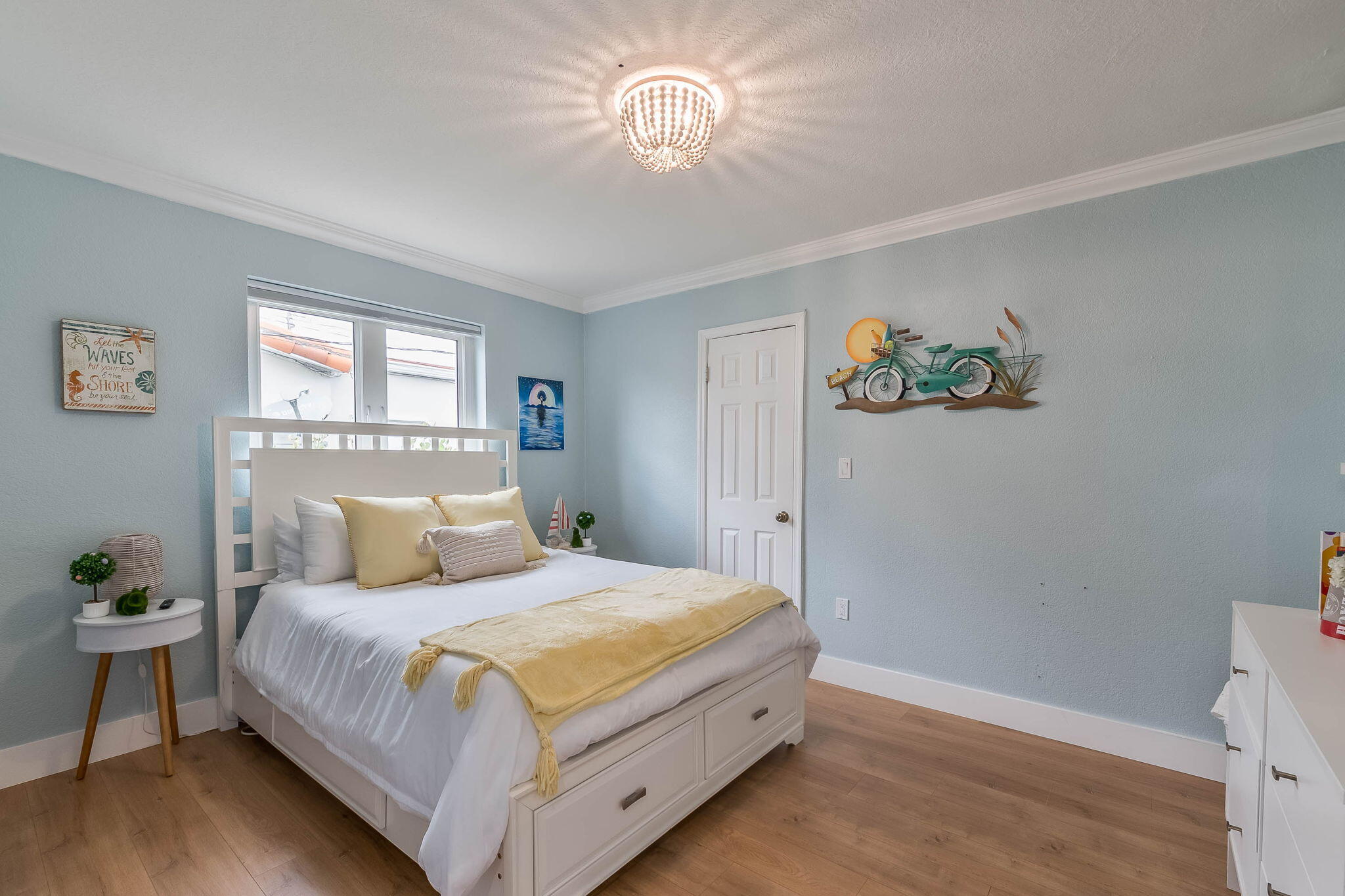6231 Southwest 94th Avenue Miami, FL 33173 - Photo 18 of 47 a bedroom with a bed and a chandelier