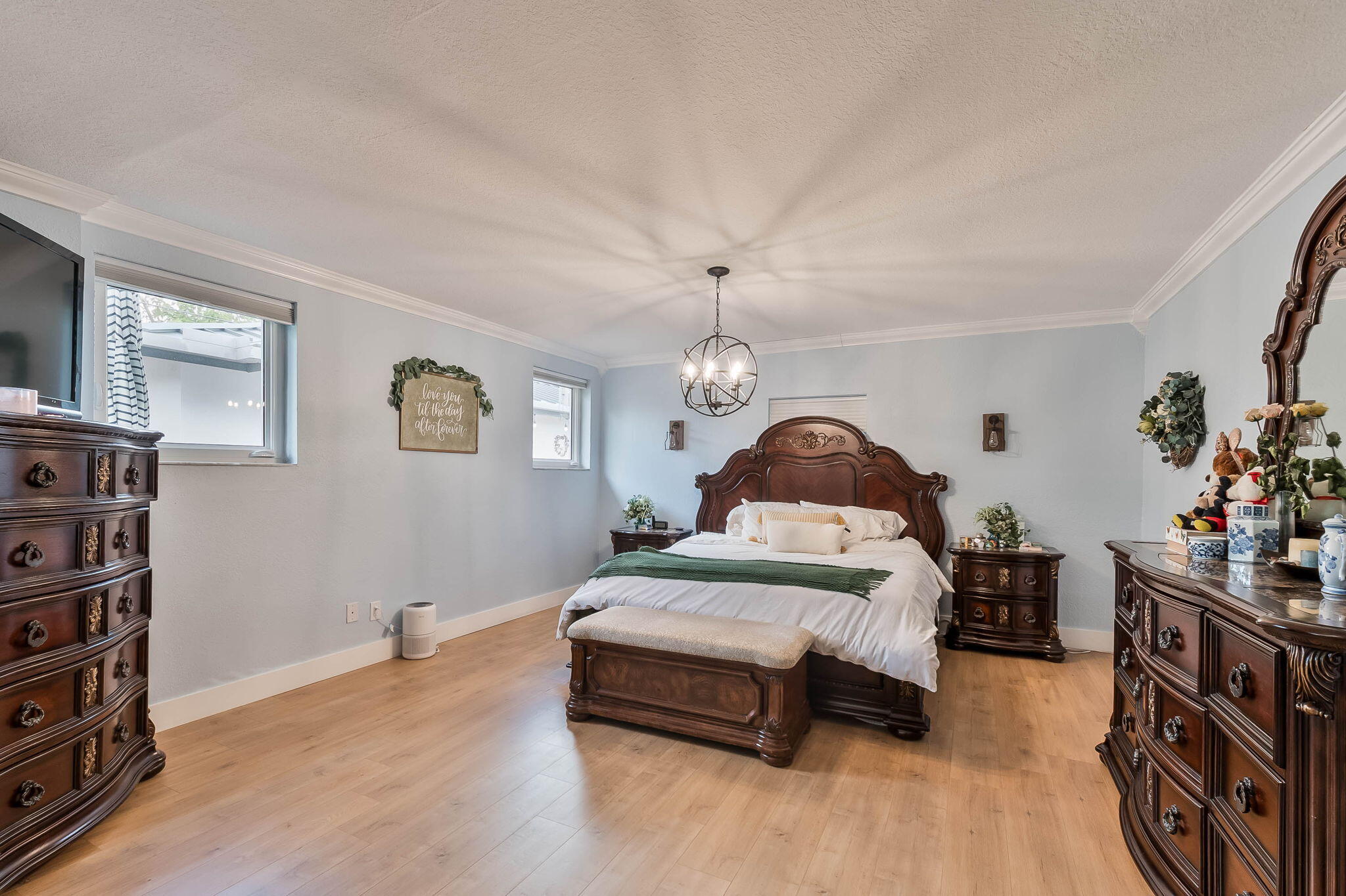 6231 Southwest 94th Avenue Miami, FL 33173 - Photo 21 of 47 a spacious bedroom with a bed and a chandelier