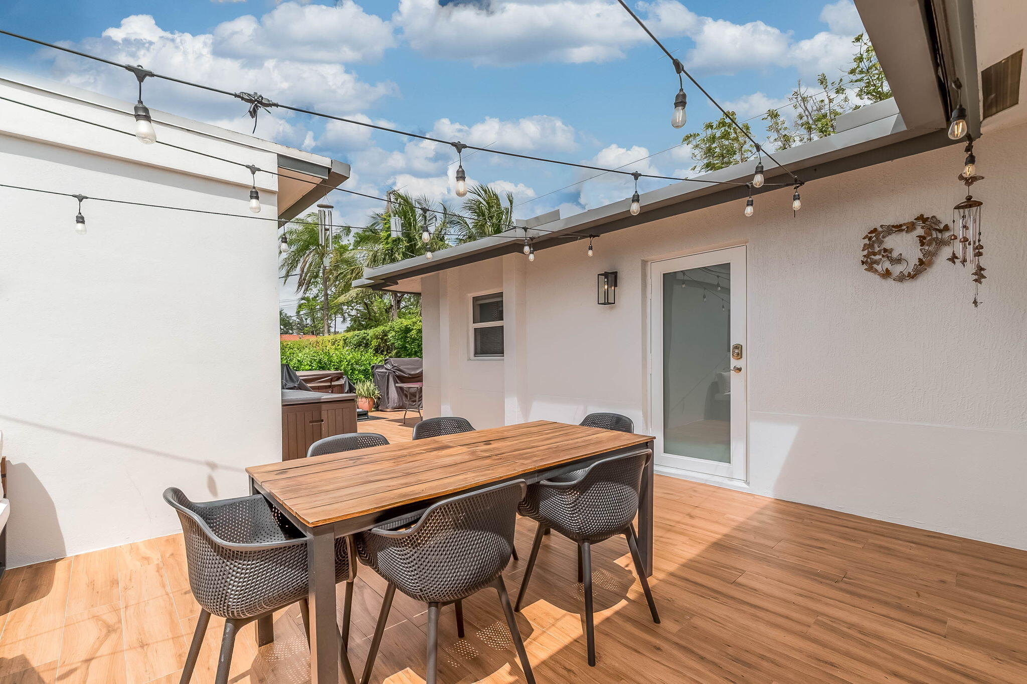 6231 Southwest 94th Avenue Miami, FL 33173 - Photo 29 of 47 a outdoor dining space with furniture and wooden floor