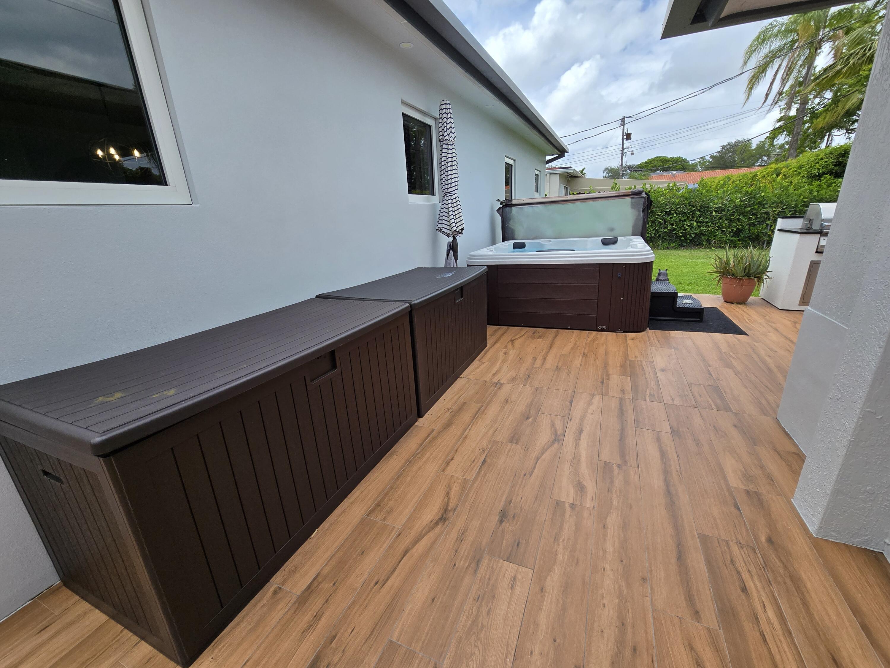 6231 Southwest 94th Avenue Miami, FL 33173 - Photo 31 of 47 a kitchen with wooden floor and sink