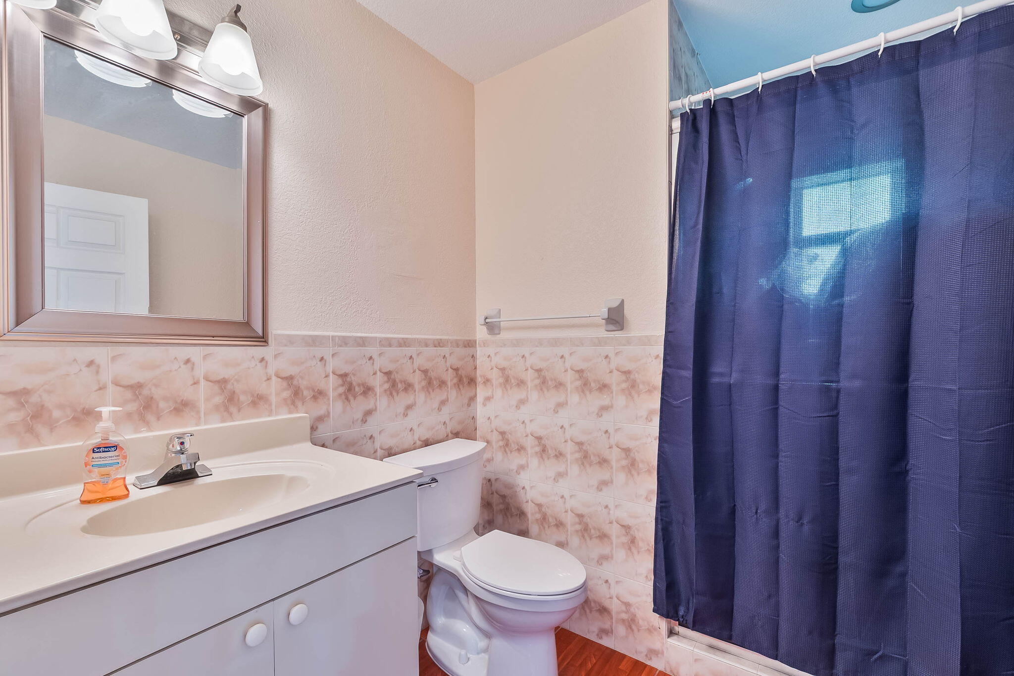6231 Southwest 94th Avenue Miami, FL 33173 - Photo 34 of 47 a bathroom with a sink a toilet and mirror