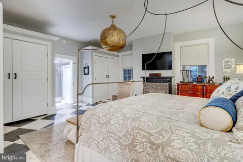 a view of a livingroom with furniture and a flat screen tv