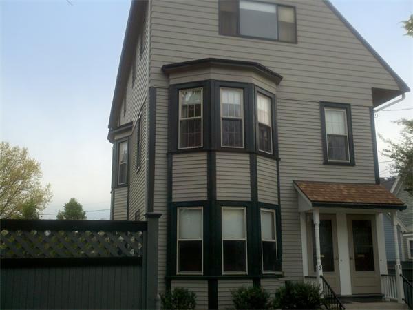 1-3 Rockingham Place Cambridge, MA 02139 - Photo 1 of 23 a front view of a house with lake