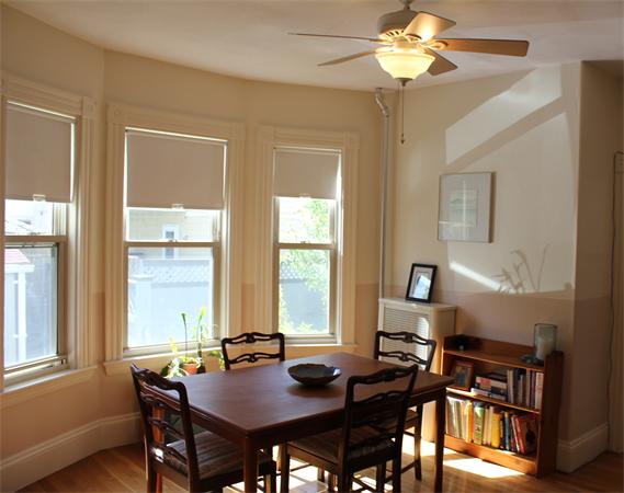 1-3 Rockingham Place Cambridge, MA 02139 - Photo 15 of 23 a view of a dining room with furniture and window