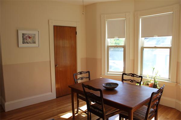 1-3 Rockingham Place Cambridge, MA 02139 - Photo 4 of 23 a view of a dining room with furniture and window