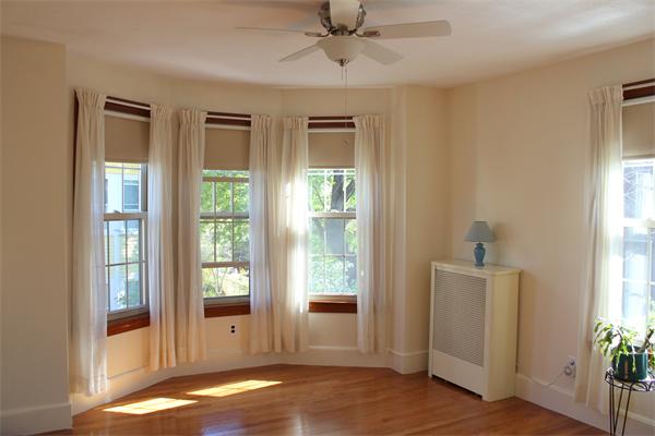 1-3 Rockingham Place Cambridge, MA 02139 - Photo 6 of 23 a view of an empty room with a window