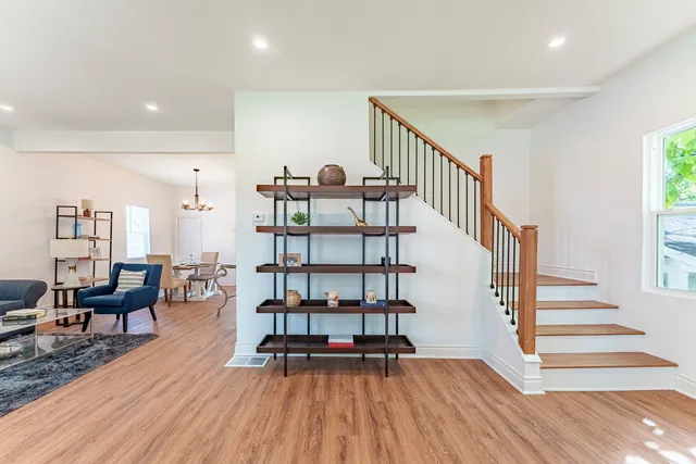 a view of entryway livingroom and hall with wooden floor