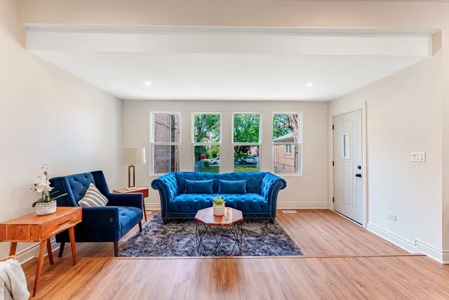 a living room with furniture and a rug