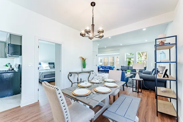 a view of a dining room with furniture window and wooden floor