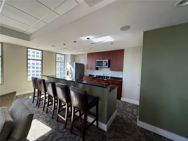 a dining room with furniture and window