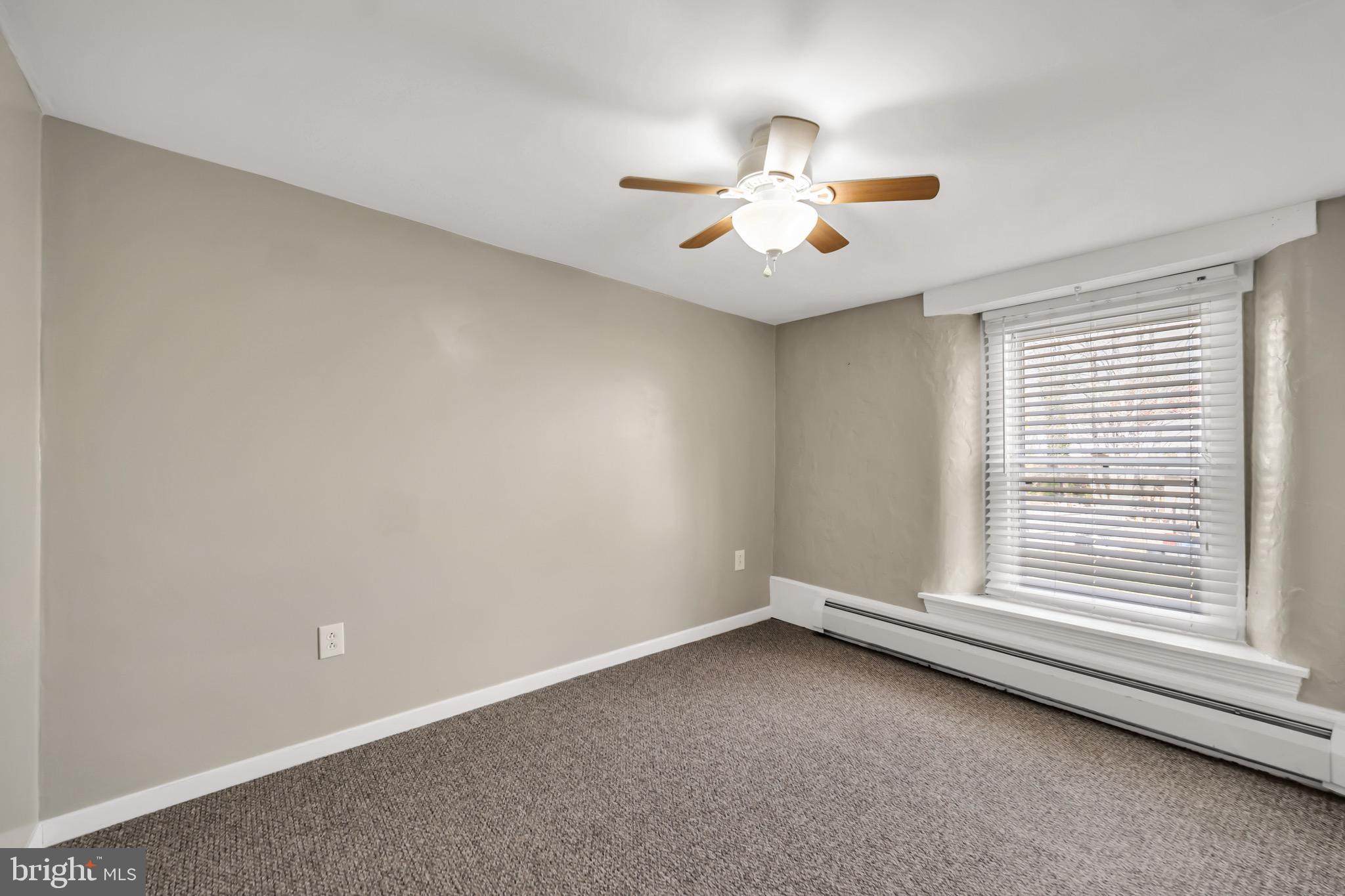 246 Cottage Avenue, Unit A Horsham, PA 19044 - Photo 12 of 21 an empty room with windows and fan
