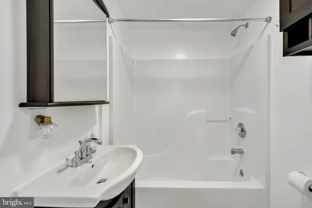 a bathroom with a sink and a bathtub