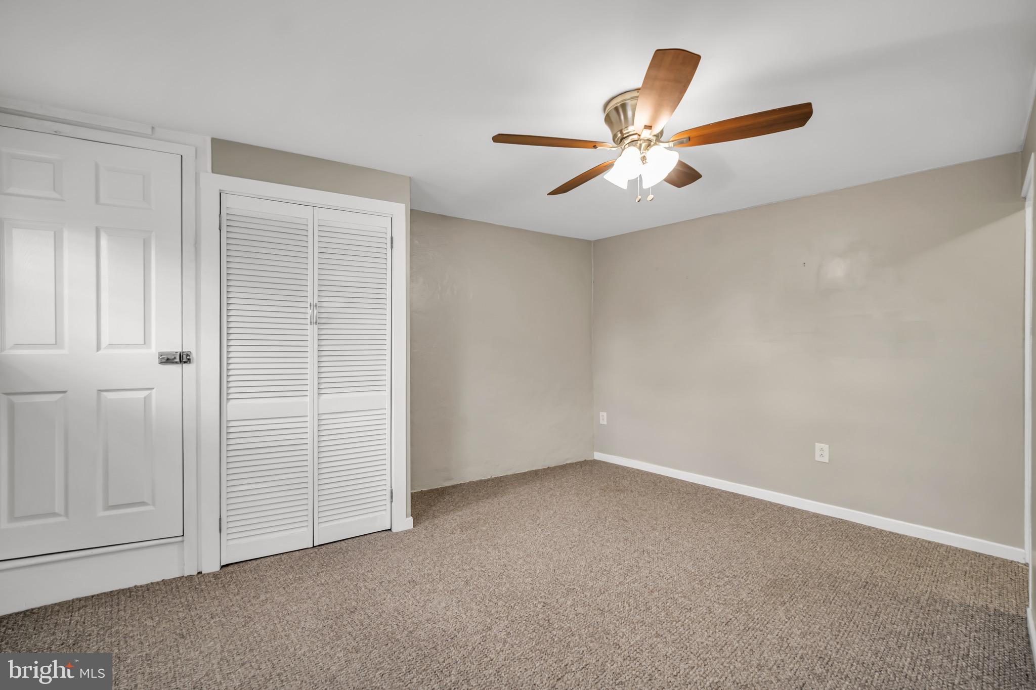 246 Cottage Avenue, Unit A Horsham, PA 19044 - Photo 16 of 21 an empty room with closet and fan