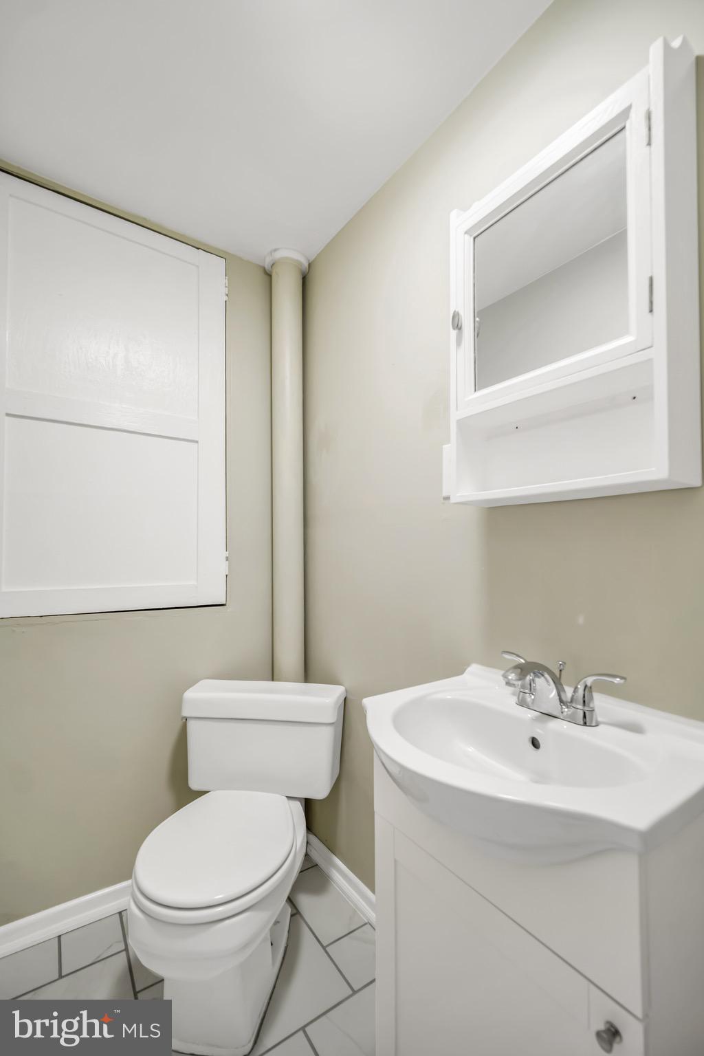 246 Cottage Avenue, Unit A Horsham, PA 19044 - Photo 18 of 21 a bathroom with a toilet sink and mirror